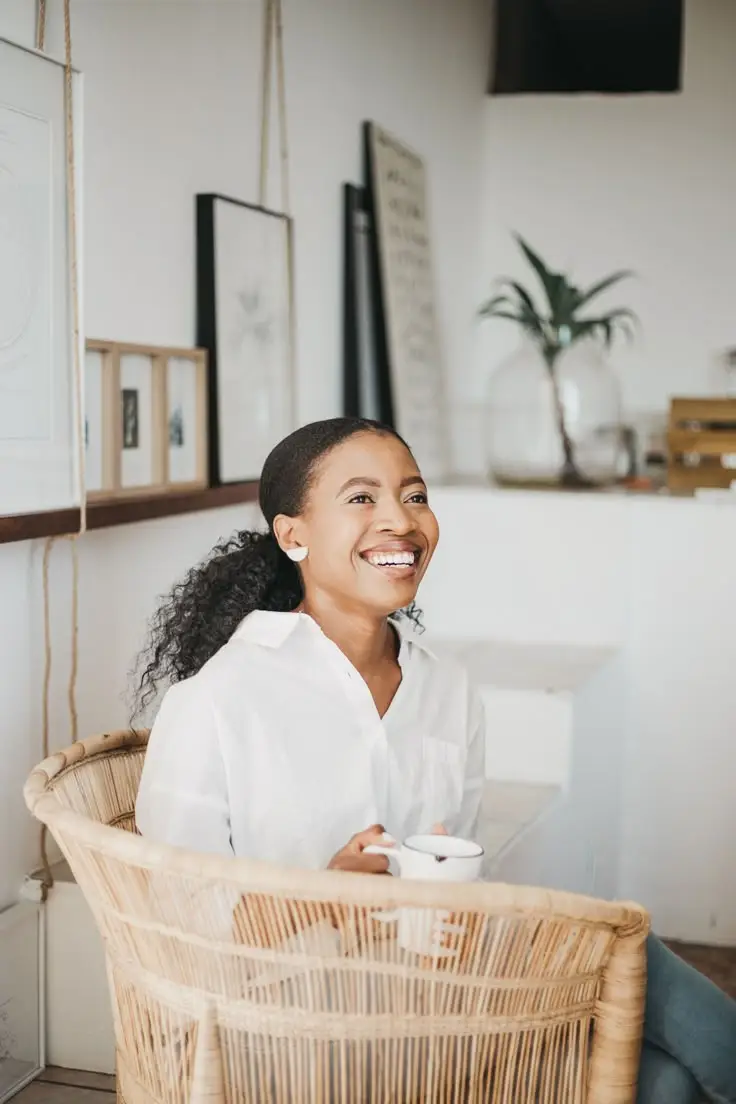 Smiling solo therapist holding coffee mug