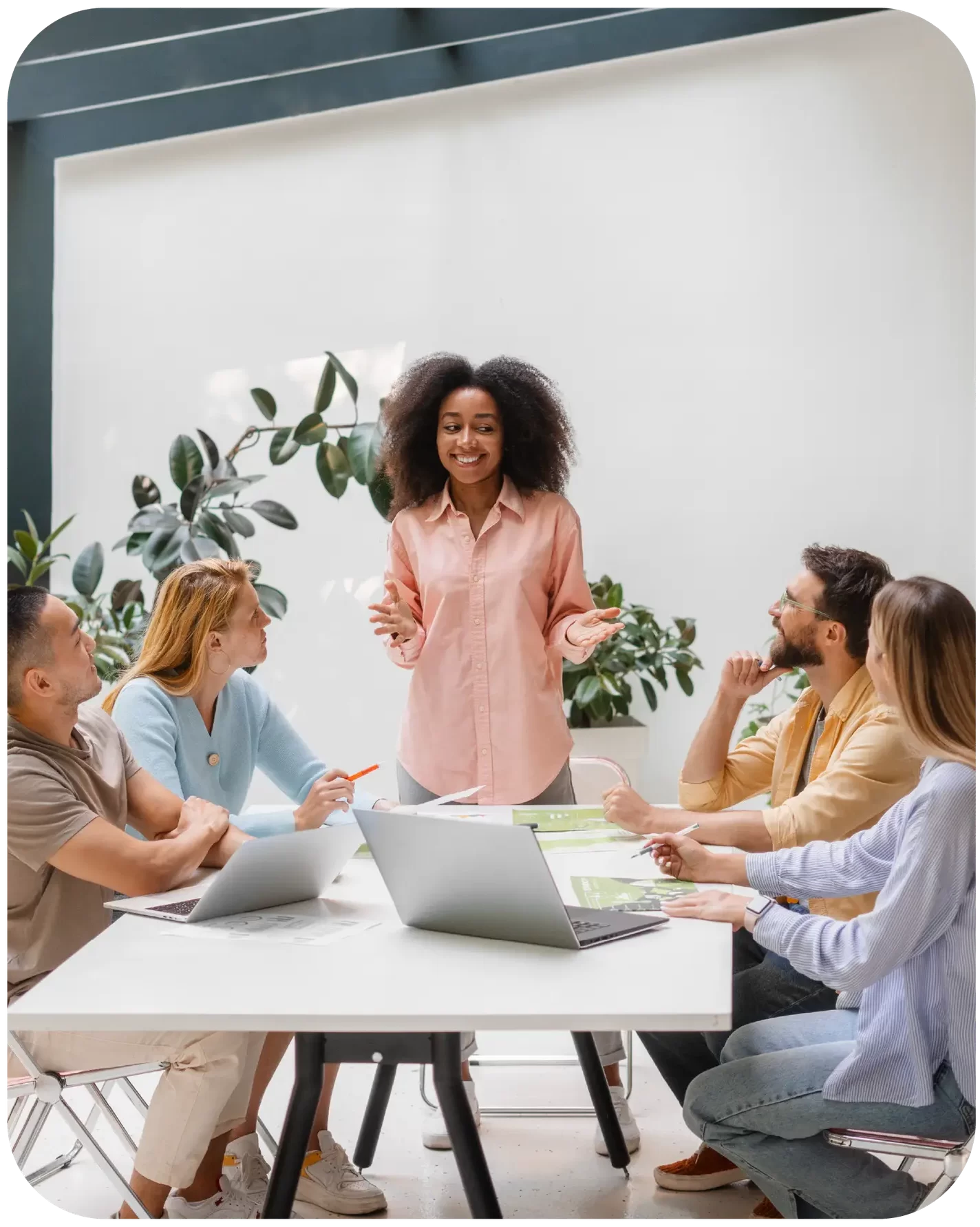 Therapist leading a group session in modern office